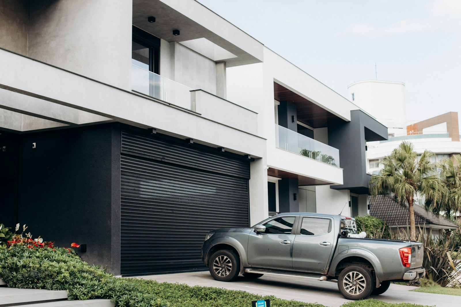 a truck is parked in front of a building, auto & renters